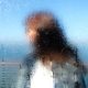 Blurred face of a woman by the sea