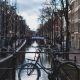 A bike on a bridge in Amsterdam. Photo by _ Harvey from Pexels