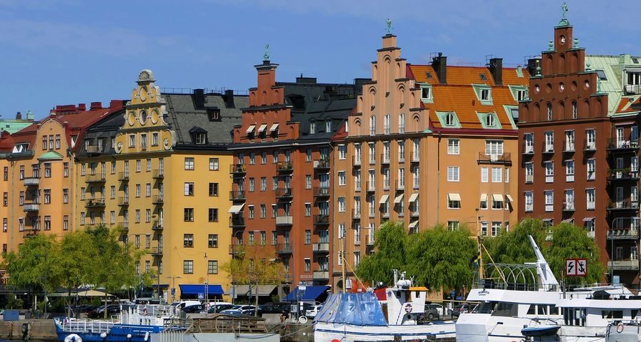 A row of colourful houses on the water in sweden