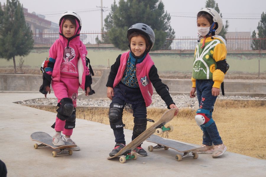 Young girls on skateboards