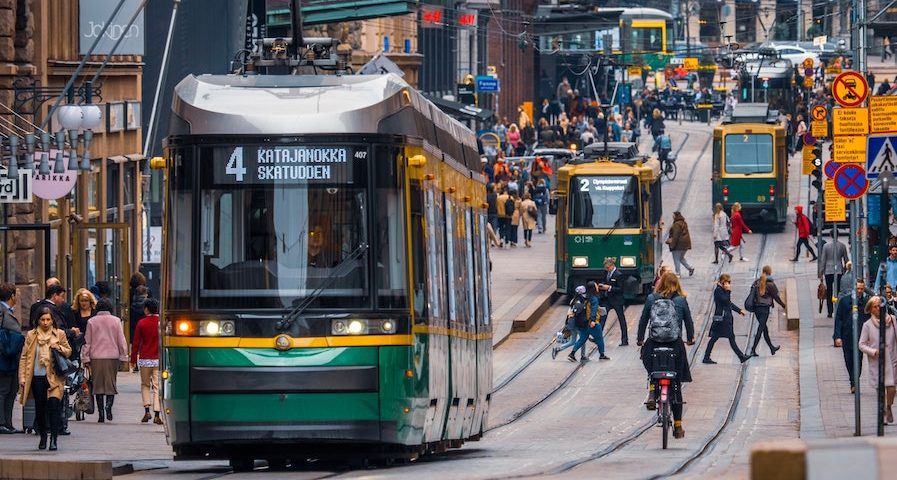 Tram on crowded street in Helsinki