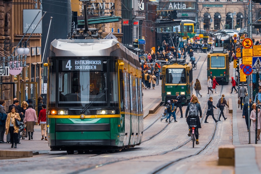 Tram on crowded street in Helsinki