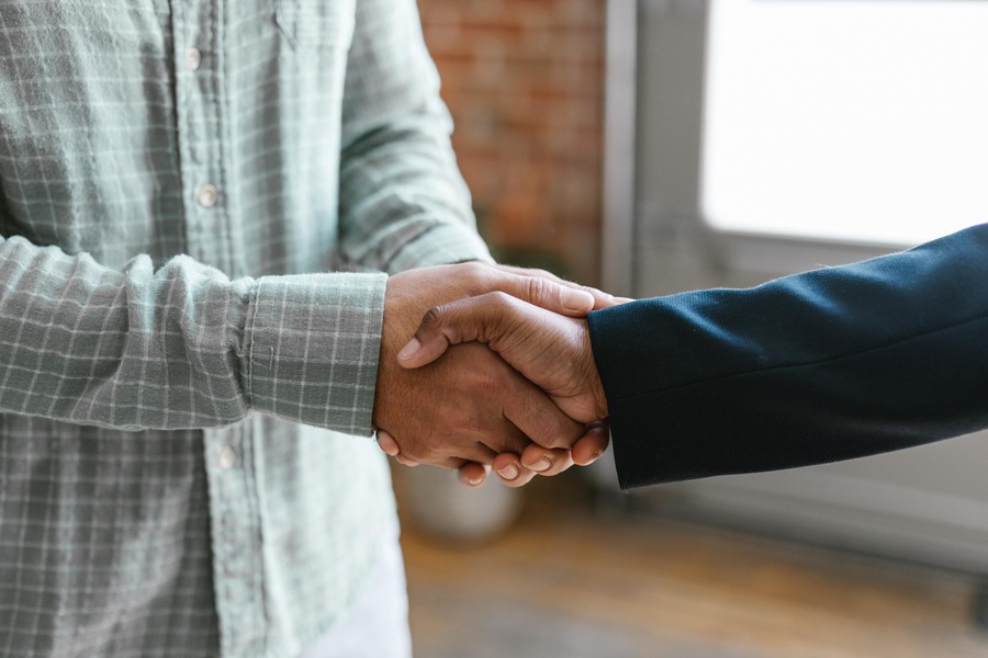 Two people shake hands. By Rodnae Productions on Pexels