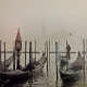 A misty scene with gondolas in Venice