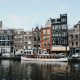 A scene of houses along the waterfront in Amsterdam. By Kata Pal on Pexels
