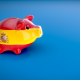 A piggy bank in the Spanish flag. By Julien Troumeur on Pixabay