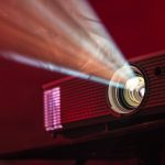 An LED projector emitting light. By Alex Litvin on Unsplash