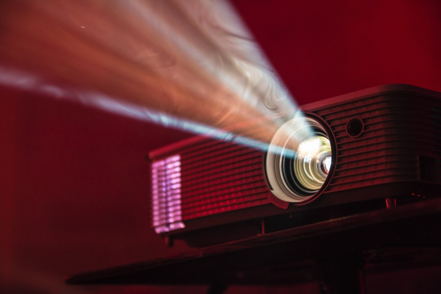 An LED projector emitting light. By Alex Litvin on Unsplash