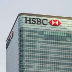 Top of a skyscraper with the HSBC logo in the top left hand corner. By Yusuf Miah on Pexels