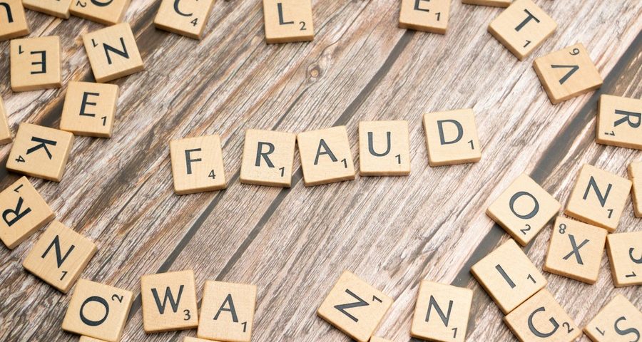Scrabble tiles spelling out 'fraud'. By Markus Winkler via Unsplash