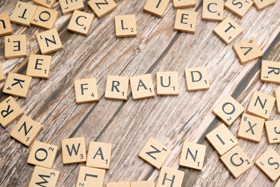 Scrabble tiles spelling out 'fraud'. By Markus Winkler via Unsplash