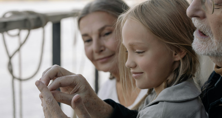 A young girl with her grandparents. By cottonbro studio via Pexels