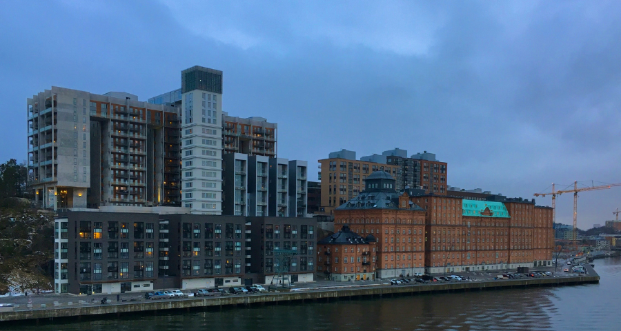 Swedish office buildings on the river. By ptrpl4 via Unsplash