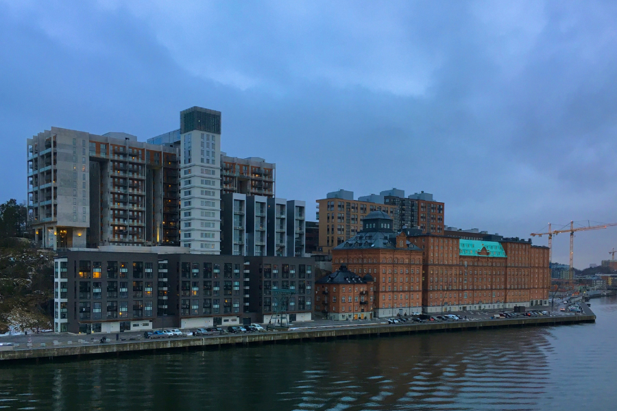 Swedish office buildings on the river. By ptrpl4 via Unsplash