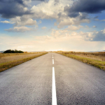 A road heading into the distance. By Pixabay