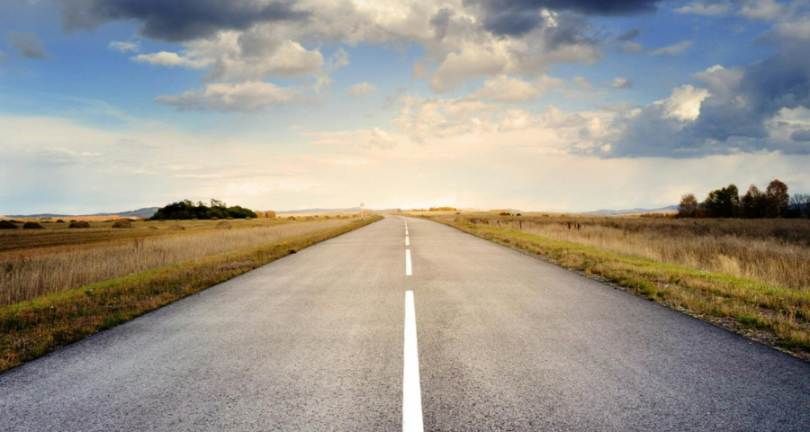 A road heading into the distance. By Pixabay