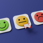 A row of three emoji faces depicting happy, so so and sad. By A Chosen Soul on Unsplash